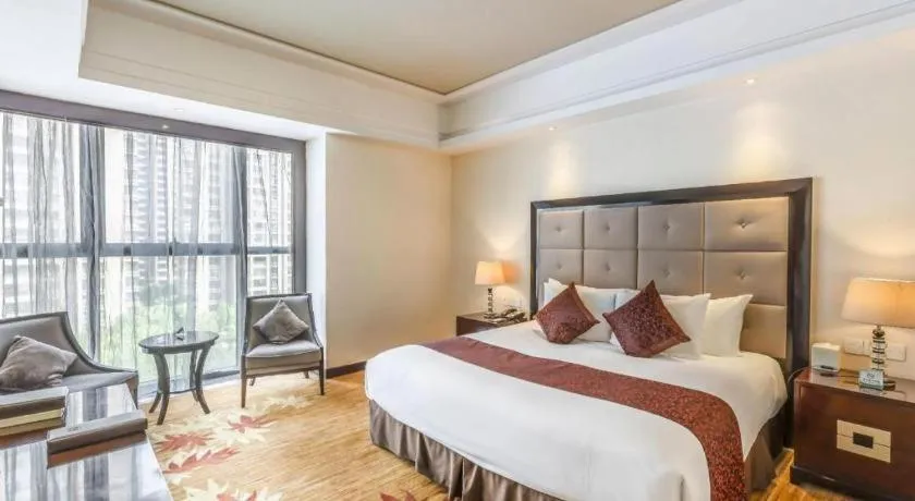 Bed in New Century Grand Hotel Xinxiang