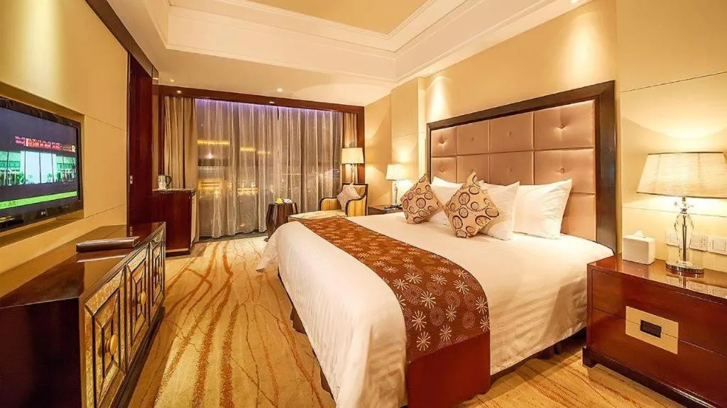 Bed in New Century Grand Hotel Xinxiang