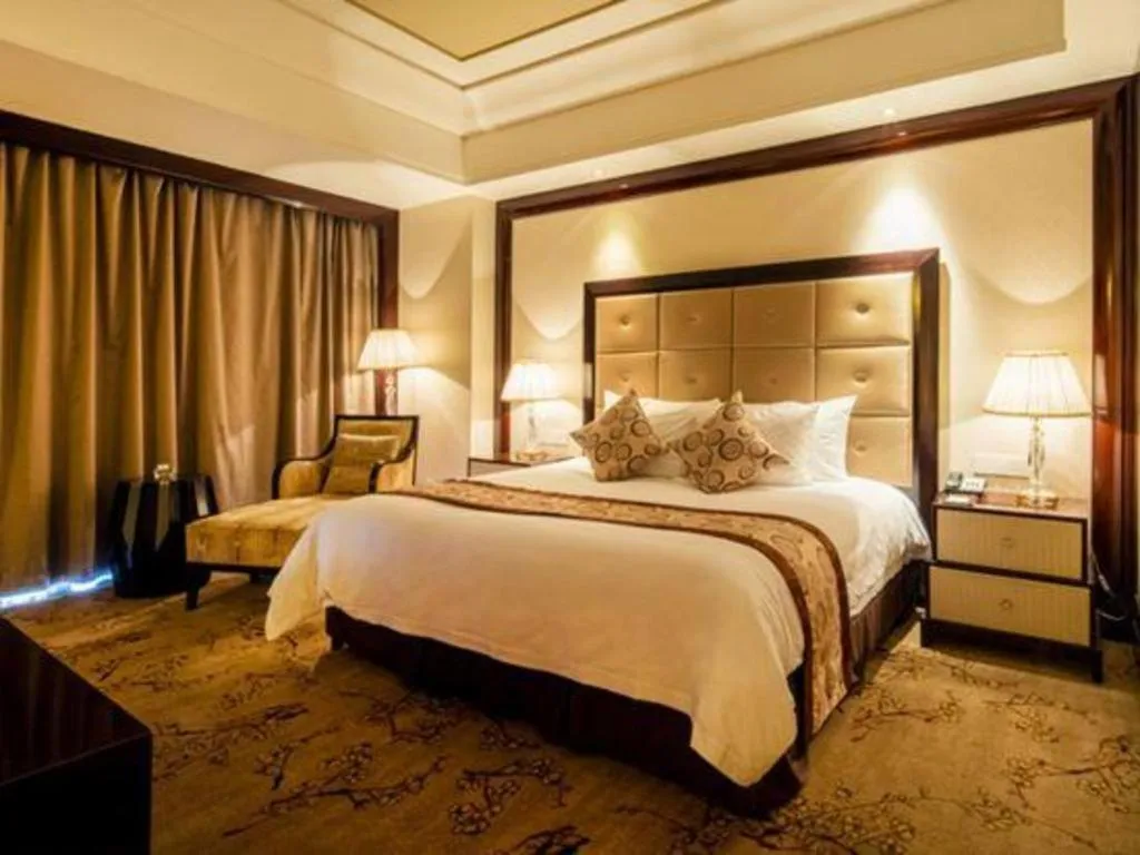 Bed in New Century Grand Hotel Xinxiang