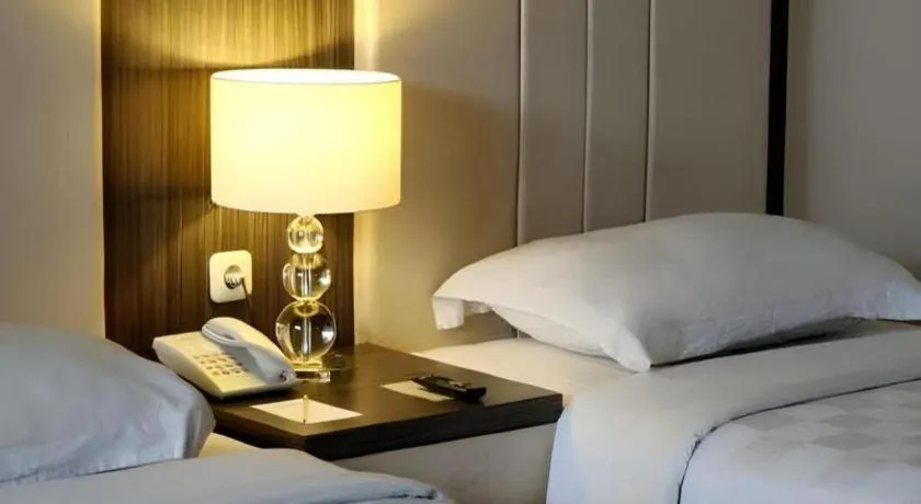 Bed in Bella Hotel Surabaya