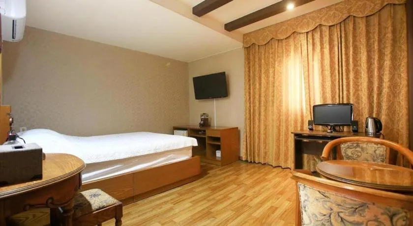 Bed in Monaco Hotel Jeju