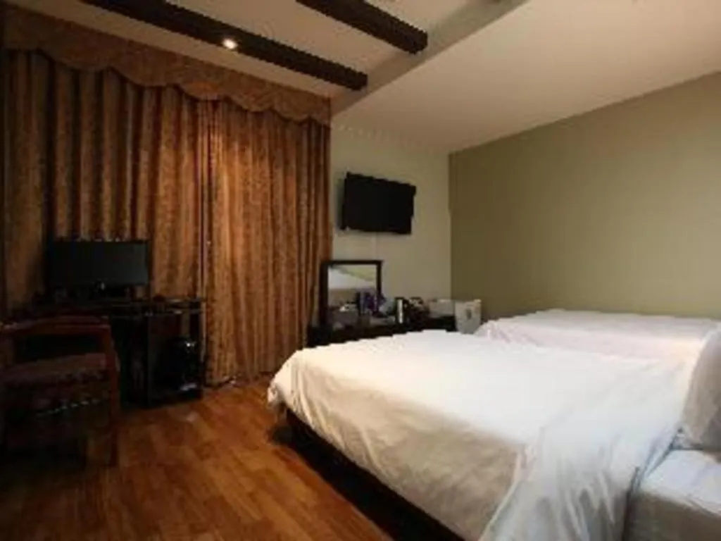 Bed in Monaco Hotel Jeju