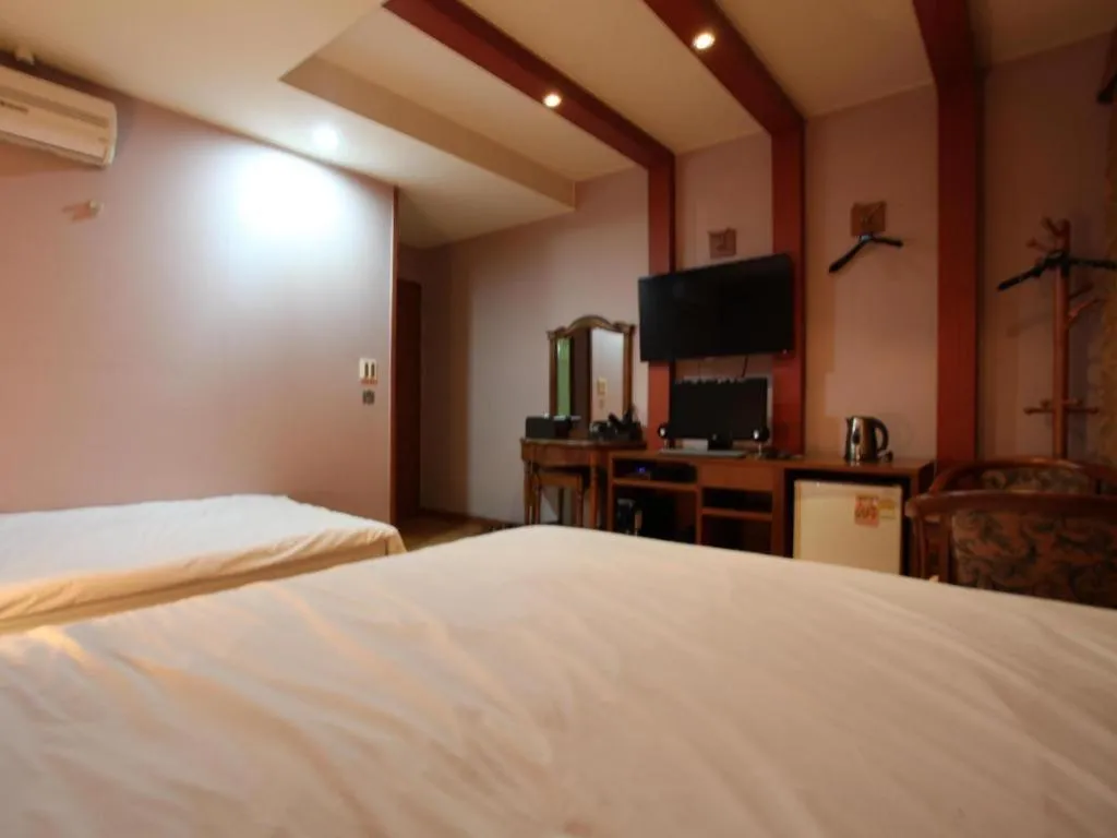 Bed in Monaco Hotel Jeju