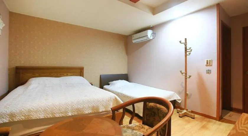 Bed in Monaco Hotel Jeju