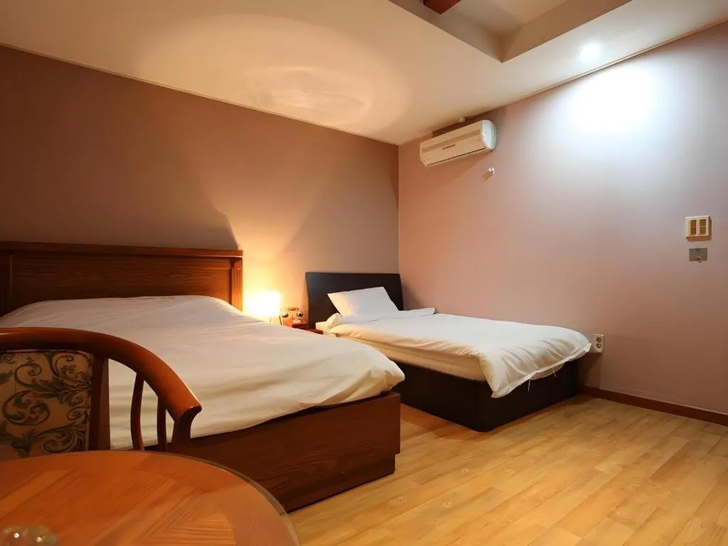 Bed in Monaco Hotel Jeju