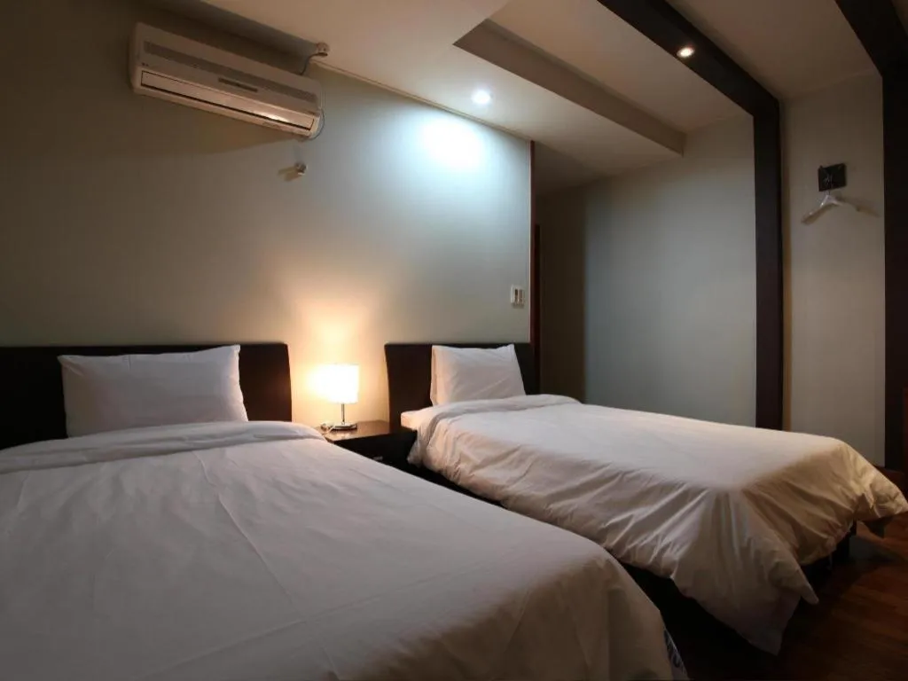 Bed in Monaco Hotel Jeju