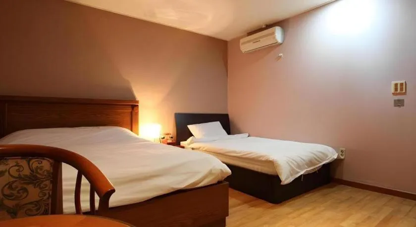 Bed in Monaco Hotel Jeju