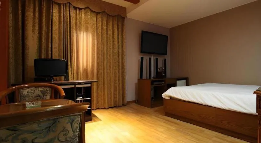 Bed in Monaco Hotel Jeju