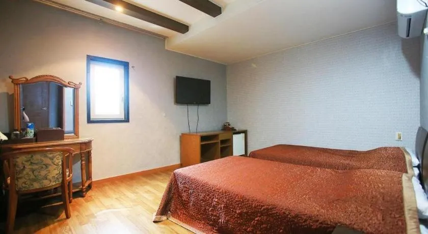 Bed in Monaco Hotel Jeju