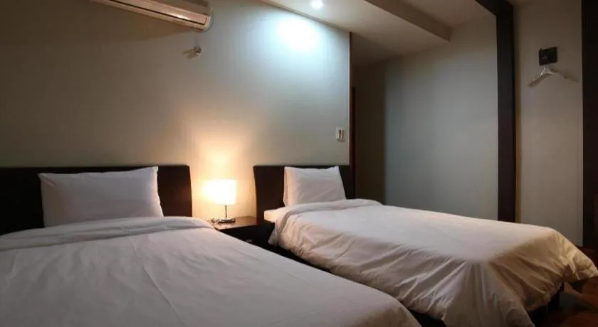 Bed in Monaco Hotel Jeju