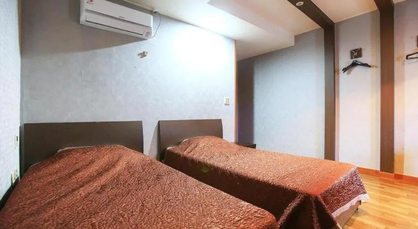 Bed in Monaco Hotel Jeju