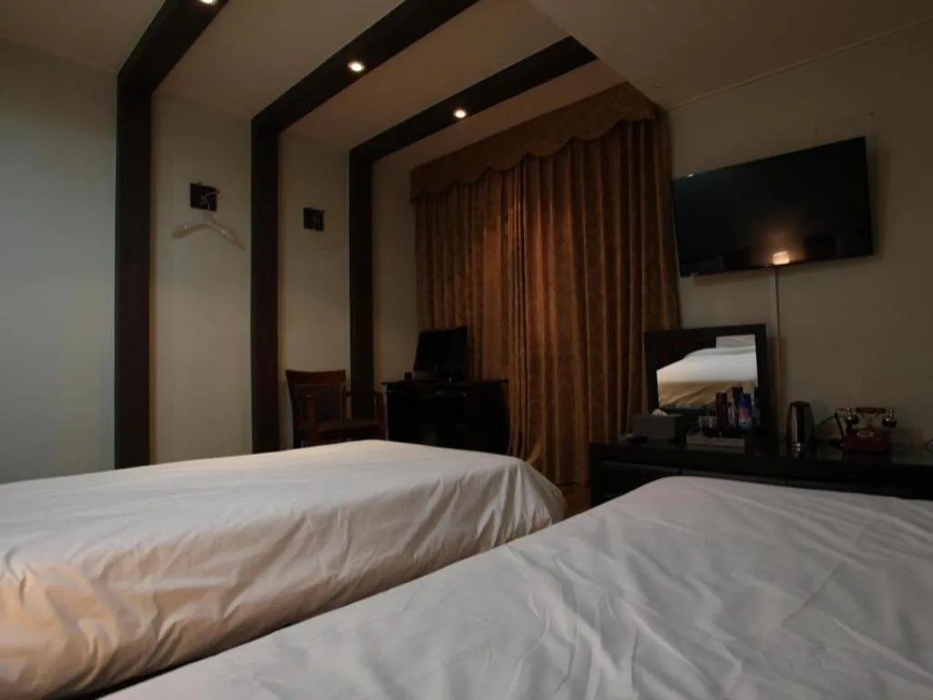 Bed in Monaco Hotel Jeju