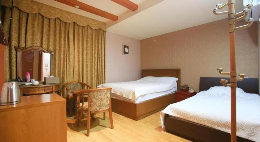 Bed in Monaco Hotel Jeju