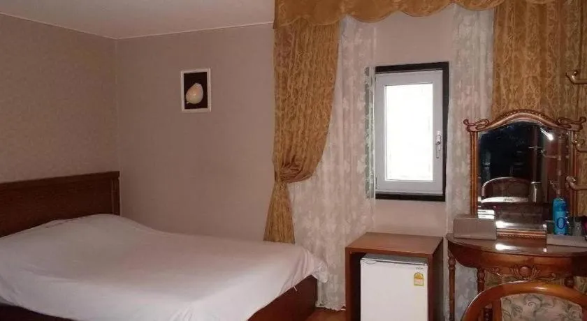 Bed in Monaco Hotel Jeju