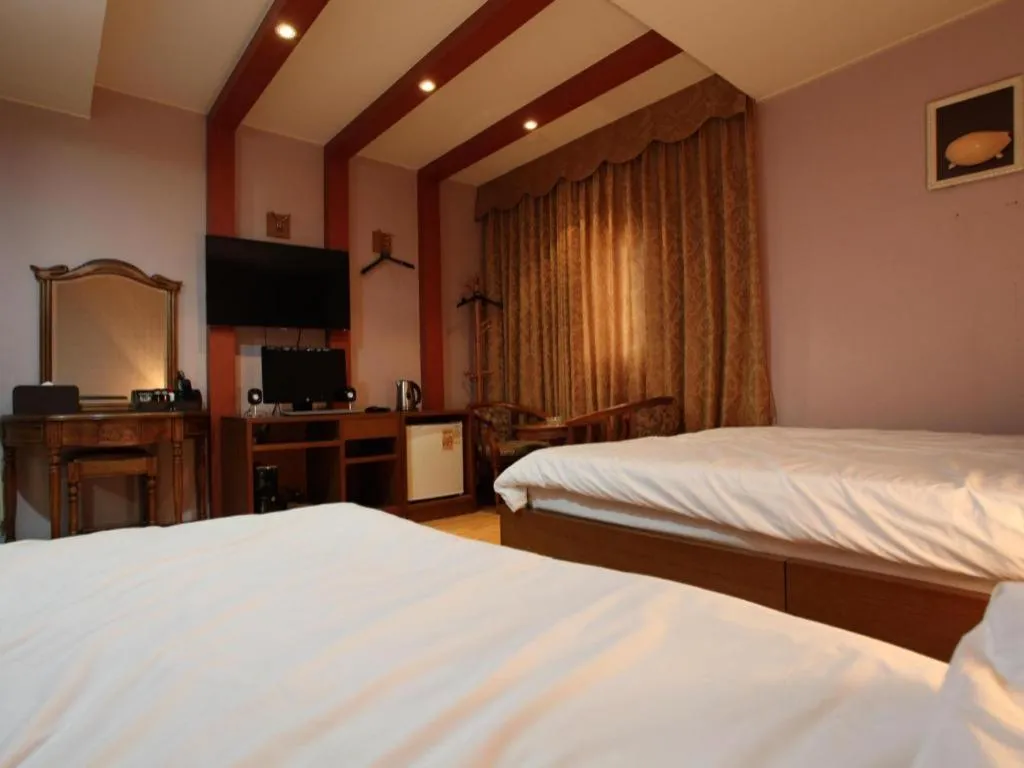 Bed in Monaco Hotel Jeju