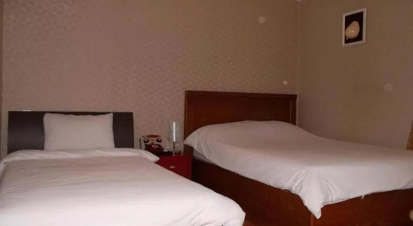 Bed in Monaco Hotel Jeju