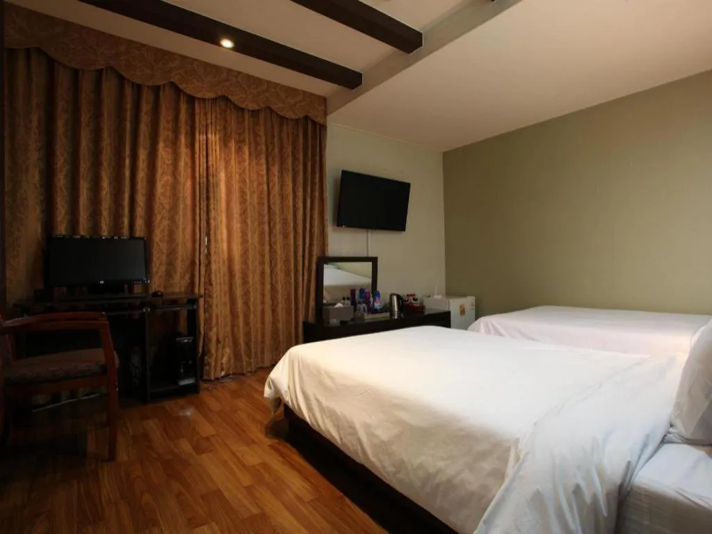 Bed in Monaco Hotel Jeju