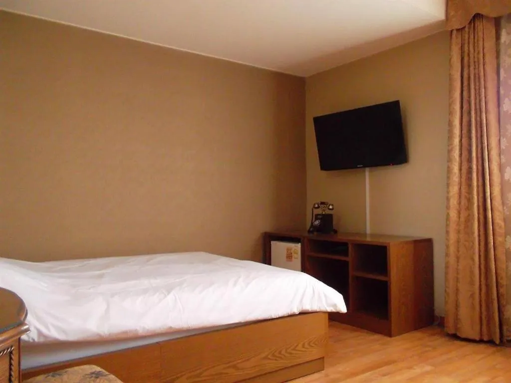 Bed in Monaco Hotel Jeju