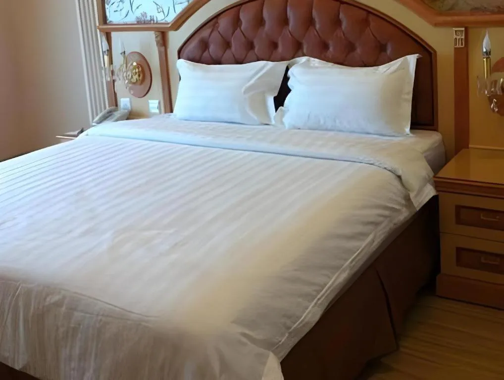 Bed in Hotel Grand Town