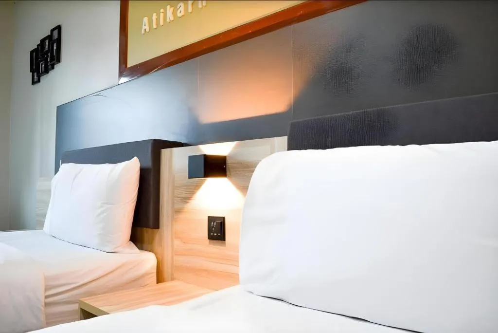 Bed in Atikarn Princess Hotel & Resort