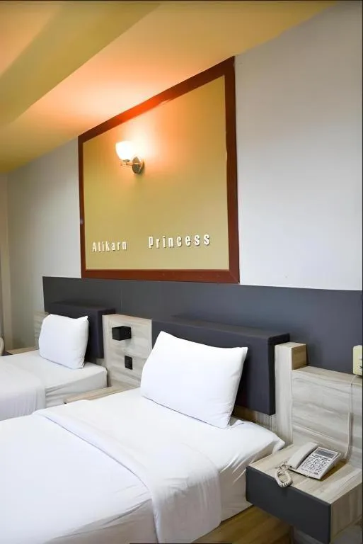 Bed in Atikarn Princess Hotel & Resort