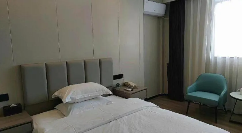 Bed in GreenTree Inn Shenzhen Kengzi Town Express Hotel