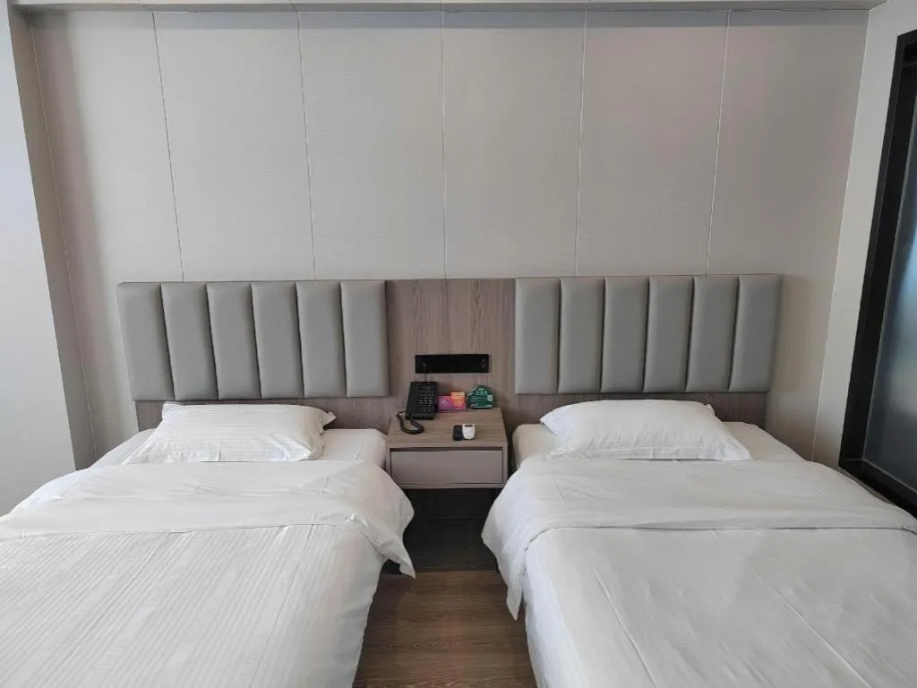 Bed in GreenTree Inn Shenzhen Kengzi Town Express Hotel