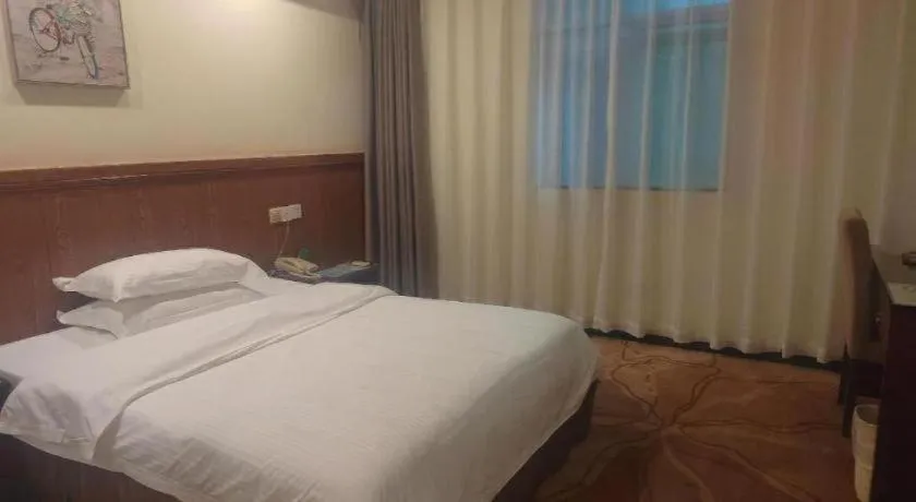 Bed in GreenTree Inn Shenzhen Kengzi Town Express Hotel