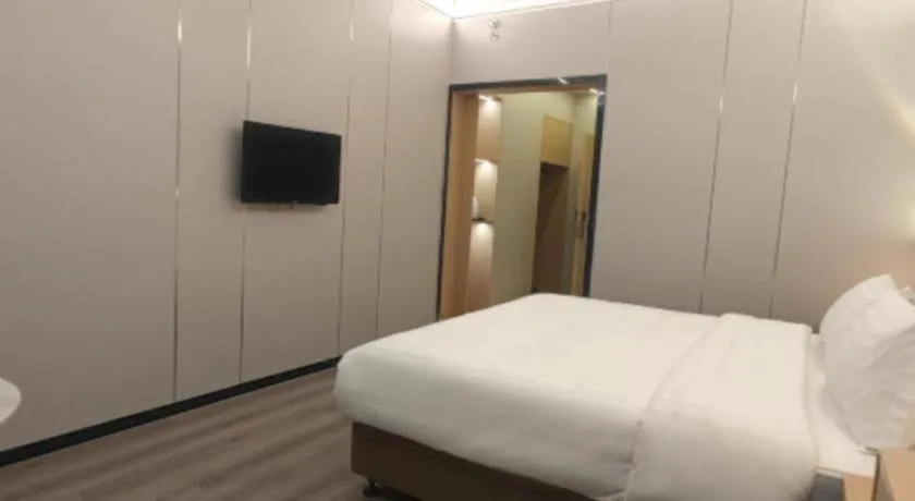 Bed in Zhenxing Hotel