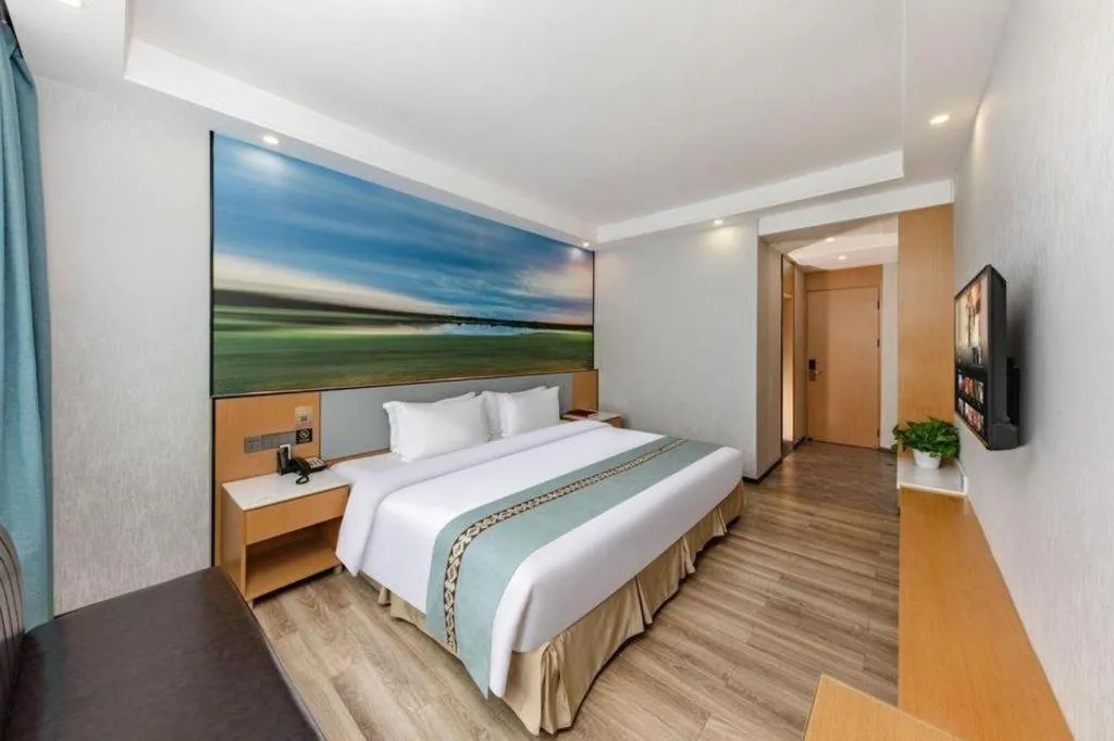 Bed in Zhenxing Hotel