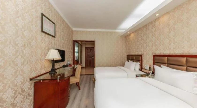 Bed in Zhenxing Hotel