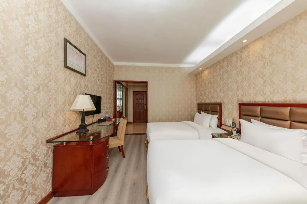 Bed in Zhenxing Hotel