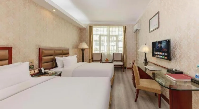 Bed in Zhenxing Hotel