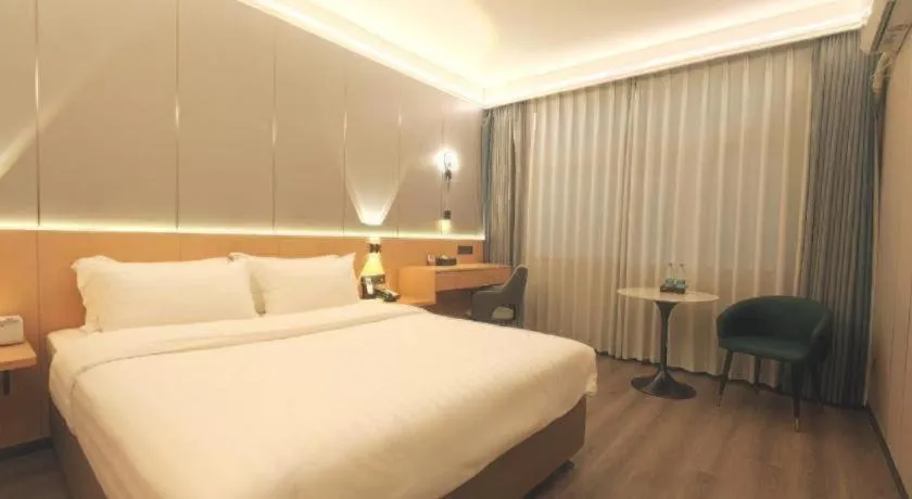 Bed in Zhenxing Hotel