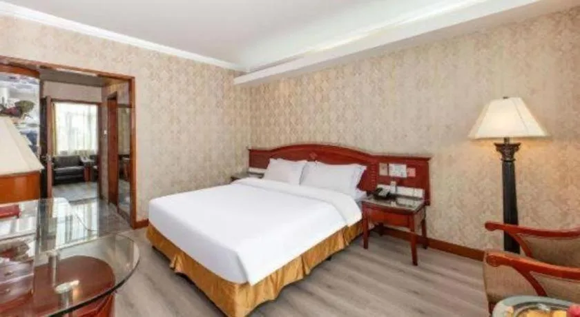 Bed in Zhenxing Hotel