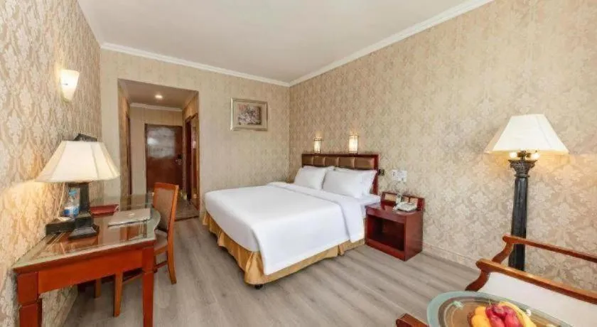 Bed in Zhenxing Hotel