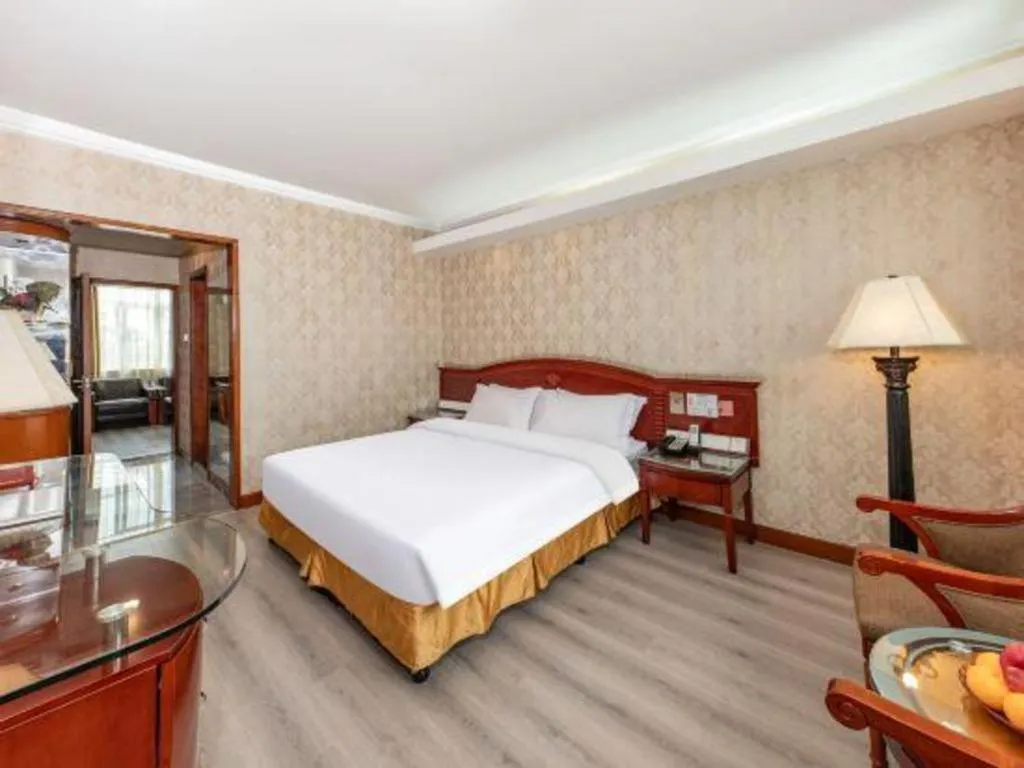 Bed in Zhenxing Hotel