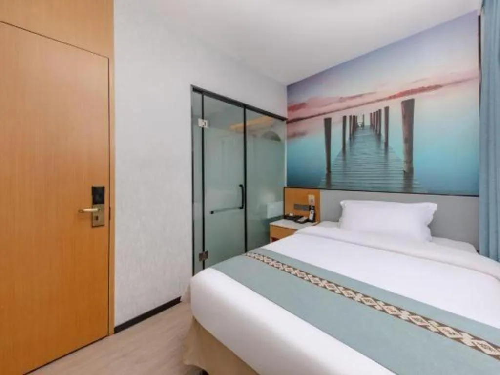 Bed in Zhenxing Hotel