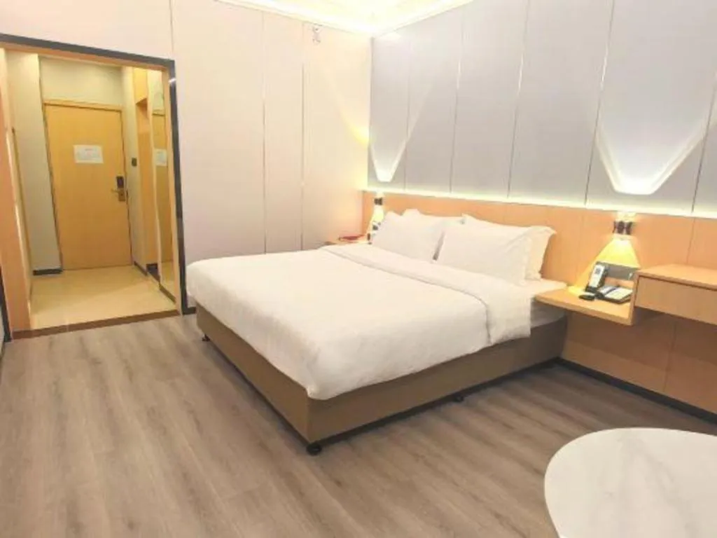 Bed in Zhenxing Hotel