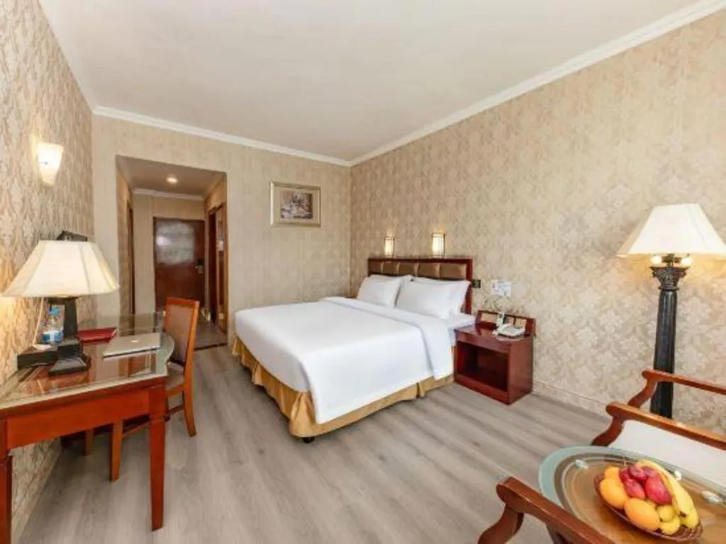 Bed in Zhenxing Hotel