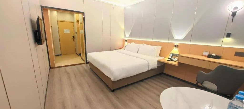 Bed in Zhenxing Hotel