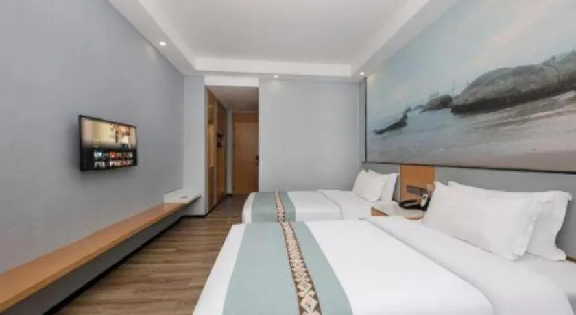 Bed in Zhenxing Hotel