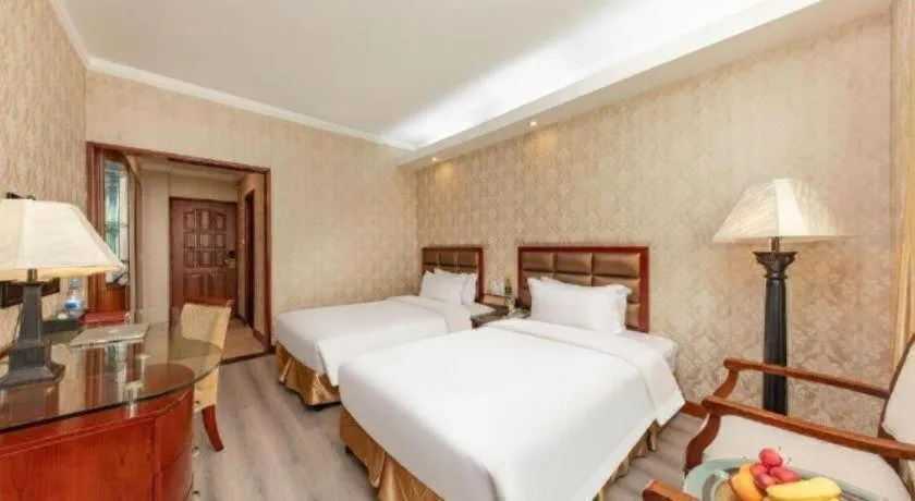 Bed in Zhenxing Hotel