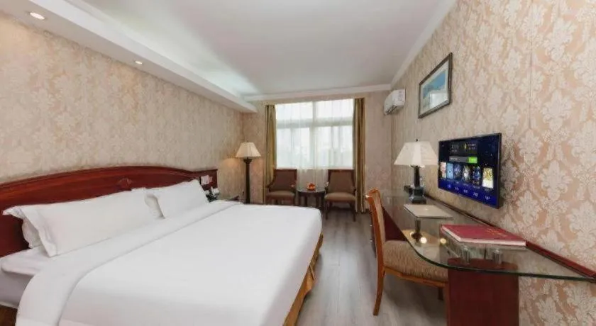 Bed in Zhenxing Hotel