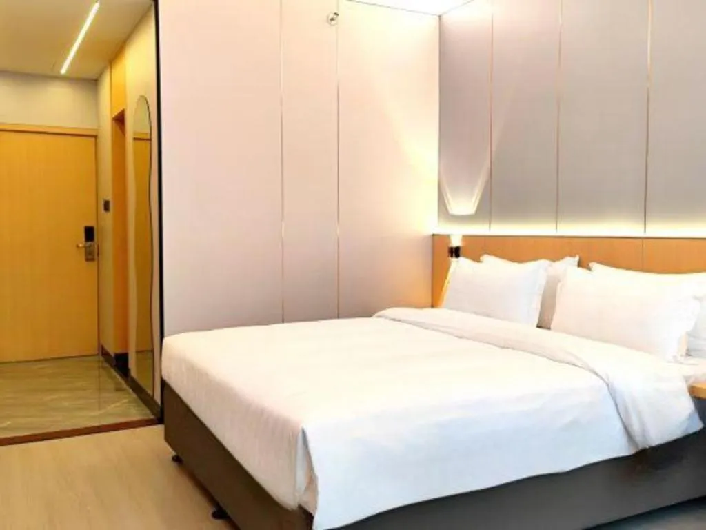 Bed in Zhenxing Hotel