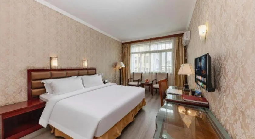 Bed in Zhenxing Hotel