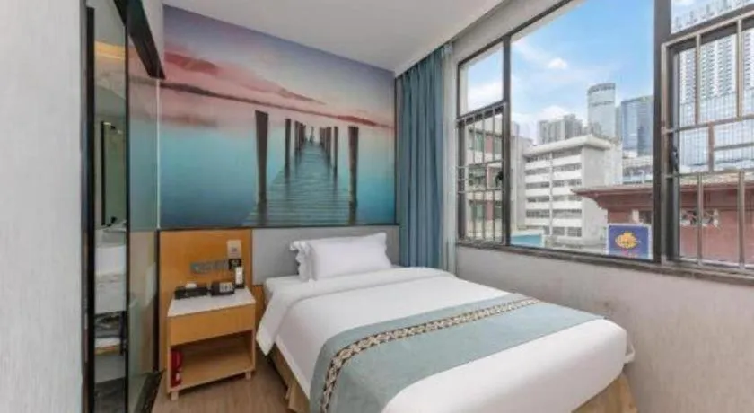 Bed in Zhenxing Hotel