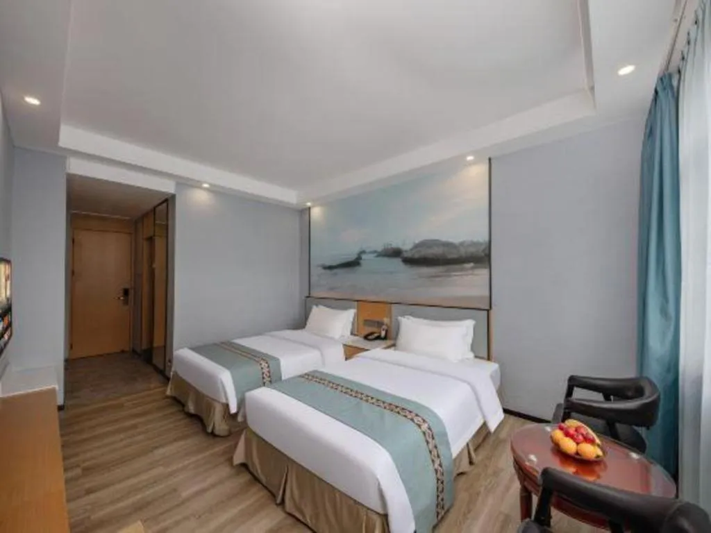 Bed in Zhenxing Hotel