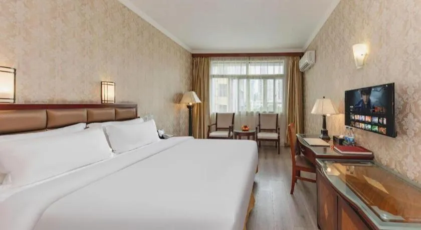 Bed in Zhenxing Hotel