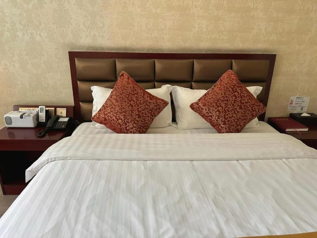 Bed in Zhenxing Hotel